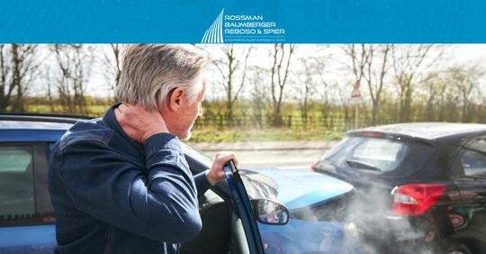 Man Holding Neck After Car Accident