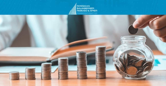 Man in Tie Stacking Up Coins