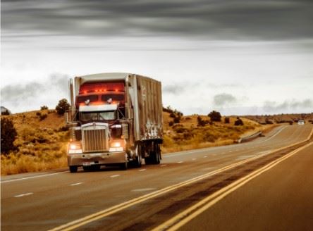 semi truck driving on the interstate