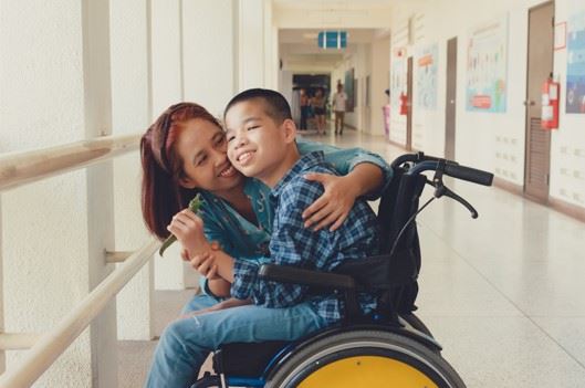 young boy with cerebral palsy in wheelchair